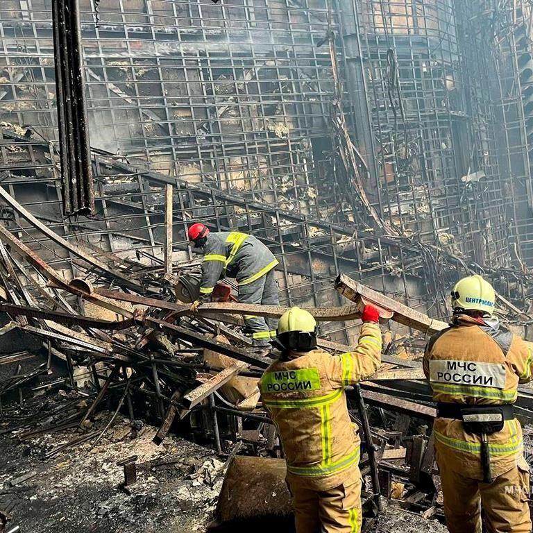 4 men charged in Moscow attack, showing signs of beatings at hearing as court says 2 accept guilt